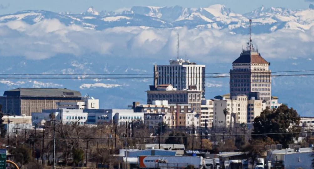 Downtown Fresno with the snow capped Sierra Nevada mountains in the distance