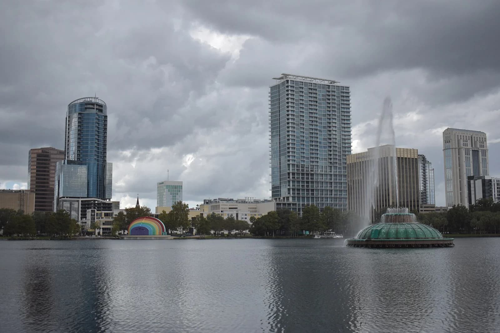Lake Eola's fountain and Amphitheater seen in the foreground with the Orlando Skyline seen in The background.